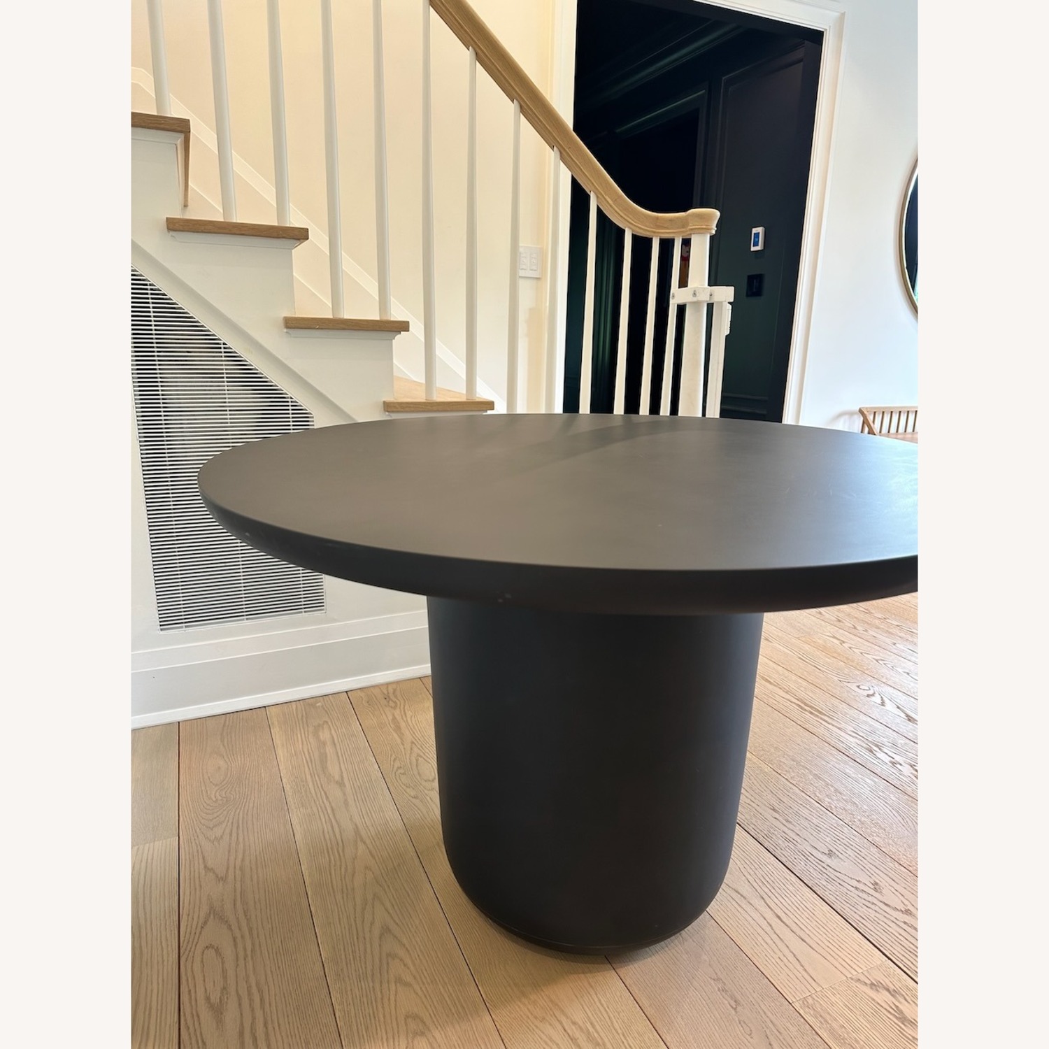 CB2 Lola 45" Round Black Concrete Dining Table - image-5