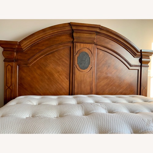 Used Ashley Furniture California King Panel Bed Frame for sale on AptDeco