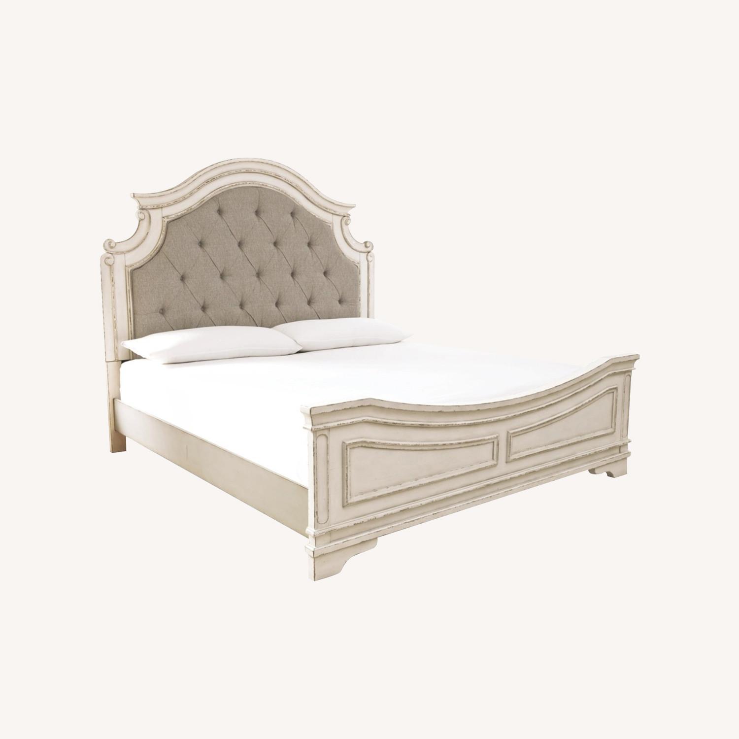 Realyn Upholstered Queen Bed - image-0