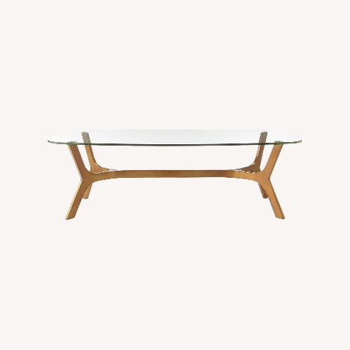 Used Crate & Barrel Glass Coffee Table W Brass Base for sale on AptDeco