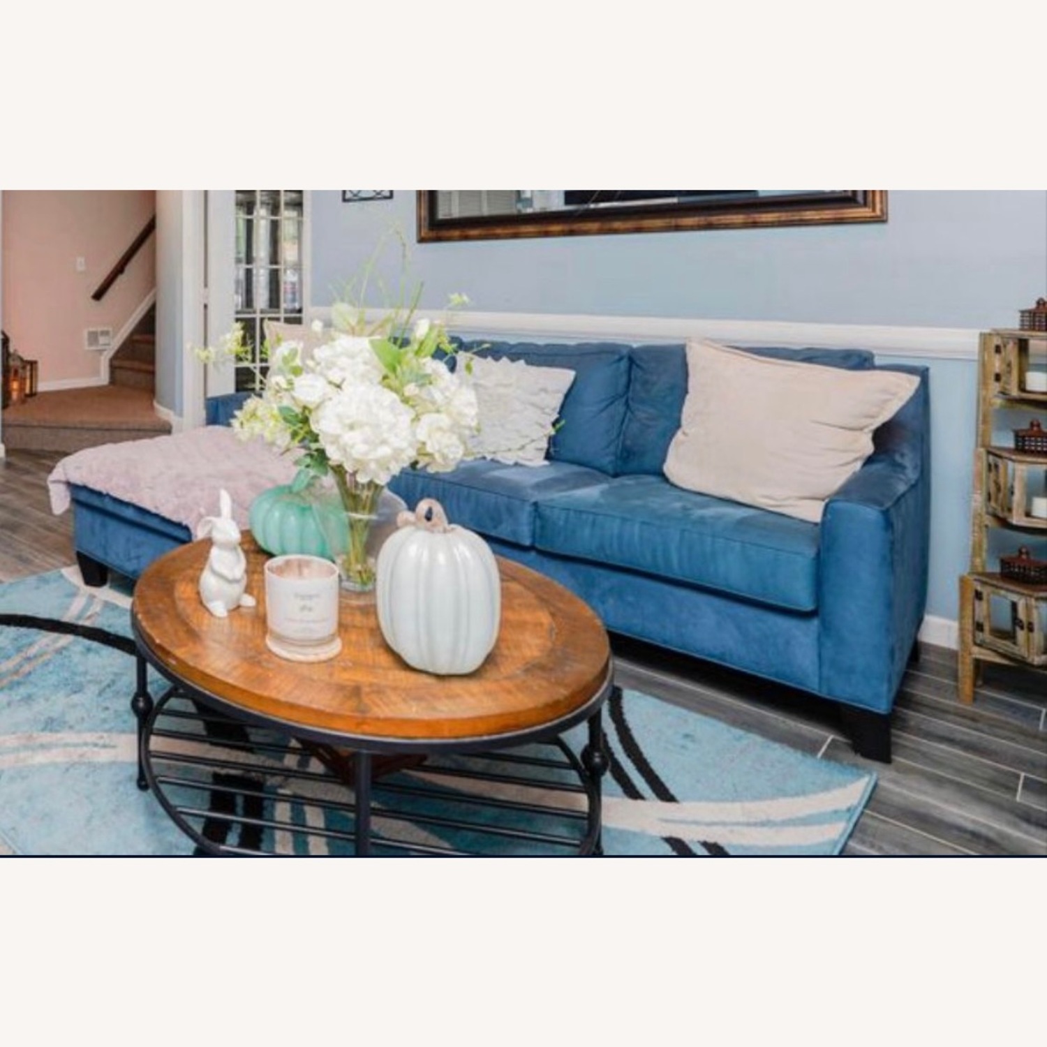 Stylish Blue Sofa Behind Ottoman - image-2