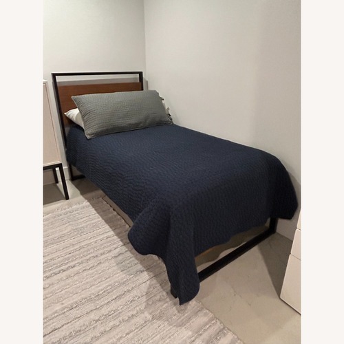 Used Twin Metal Platform Bed with Wood Details for sale on AptDeco