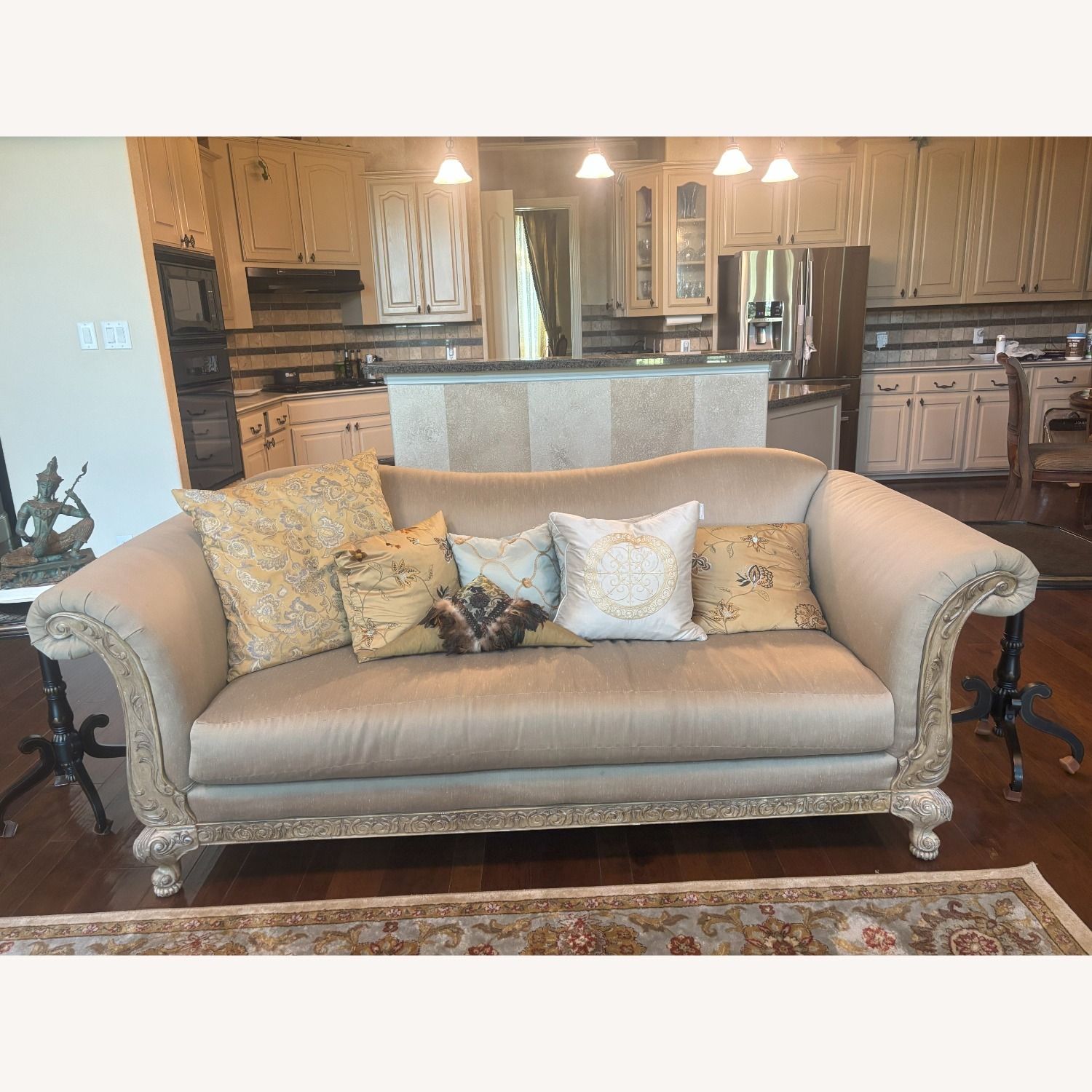 Silk Upholstered Sofa with Ornate Carved Wood Trim - image-1