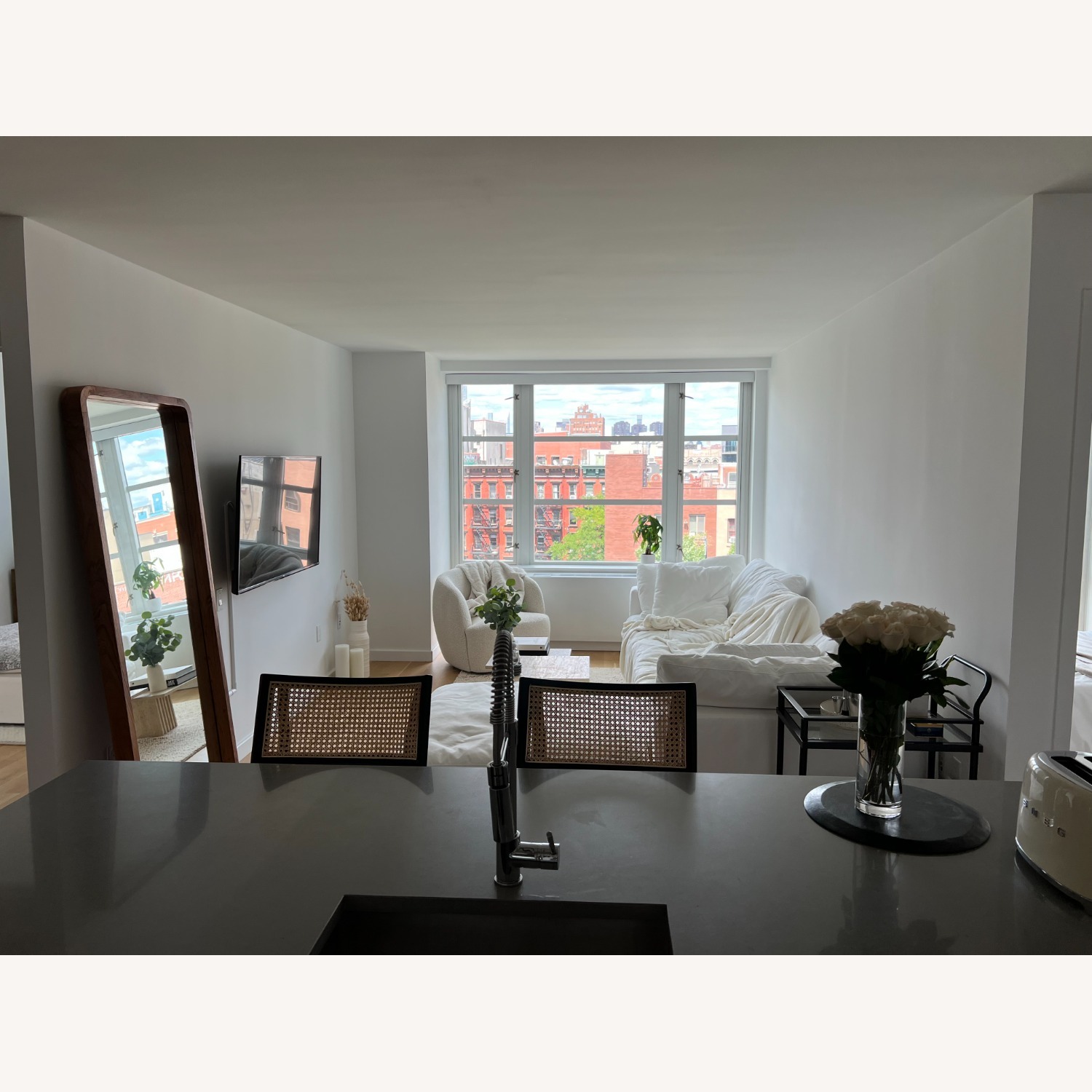 Crate & Barrel Libby Black and Natural Cane Stools - image-3