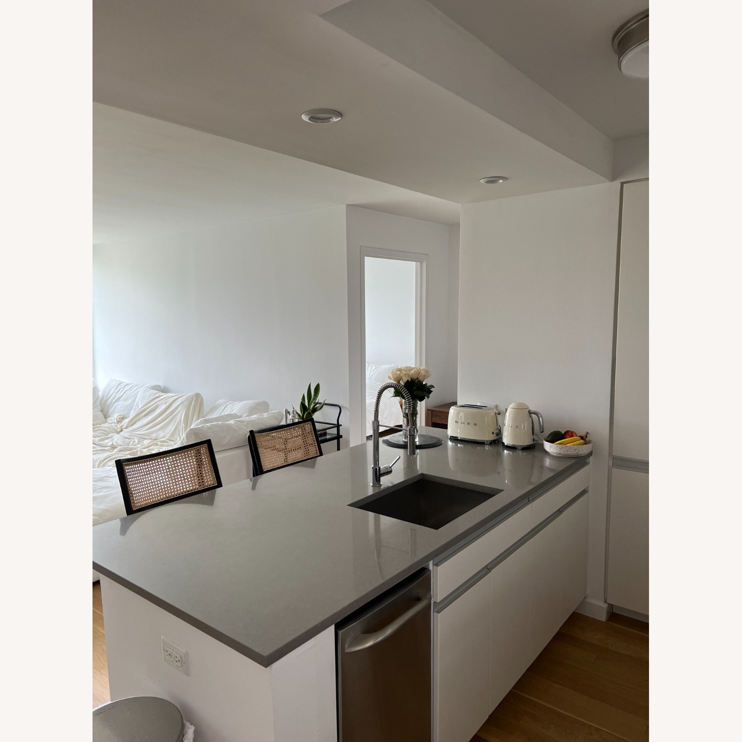 Crate & Barrel Libby Black and Natural Cane Stools - image-2