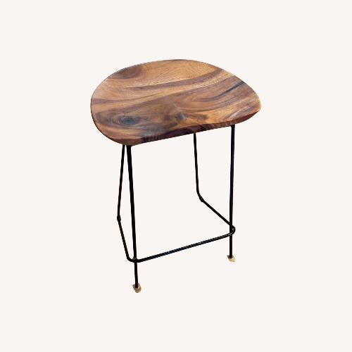 Used Handsome Contoured Wood Stools With Metal Base for sale on AptDeco