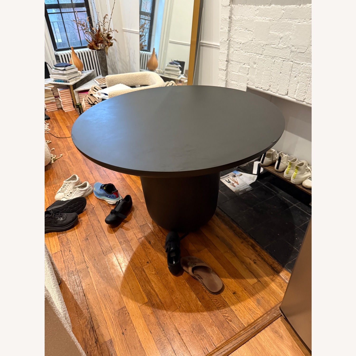 CB2 Lola 45" Round Black Concrete Dining Table - image-1