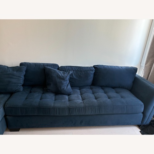 Used Rooms To Go L- Shaped Sectional With Ottoman for sale on AptDeco