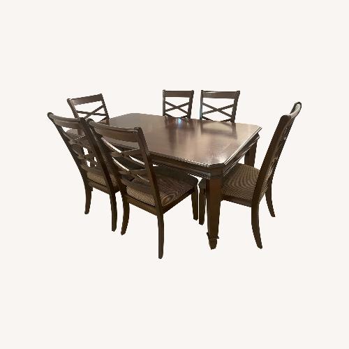 Used Ashley Furniture Solid Wood Extendable Dining Table for sale on AptDeco
