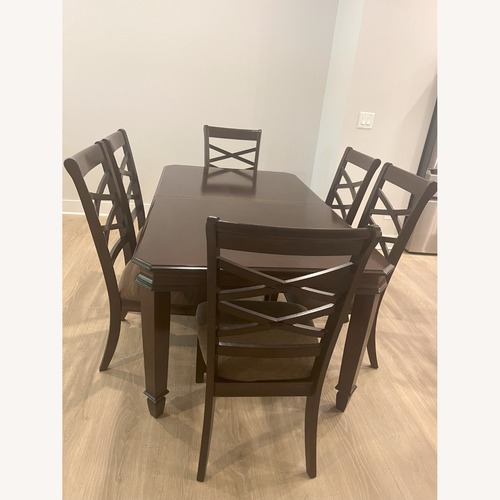 Used Ashley Furniture Solid Wood Extendable Dining Table for sale on AptDeco