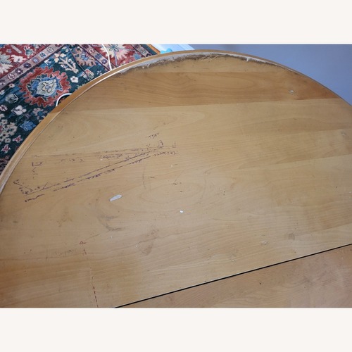 Used Natural Wood Round Kitchen/Dining Table for sale on AptDeco