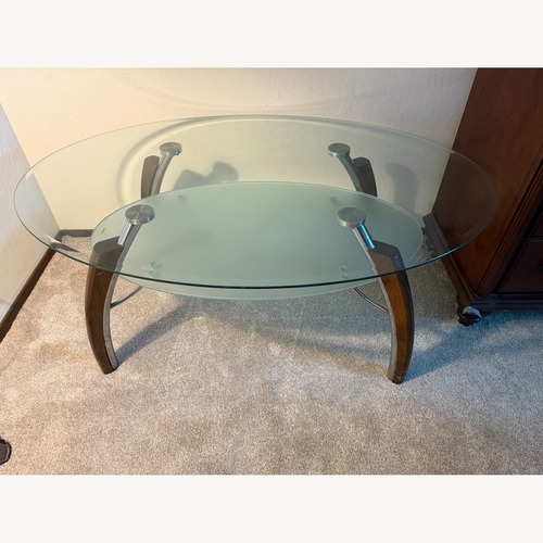 Used Glass Coffee Table with Wooden & Steel Legs for sale on AptDeco
