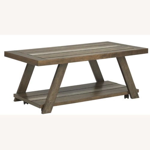 Used Rooms To Go Cedar Creek Coffee Table for sale on AptDeco