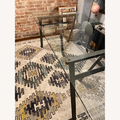 Used Crate & Barrel Industrial Dining Table with Glass Top for sale on AptDeco