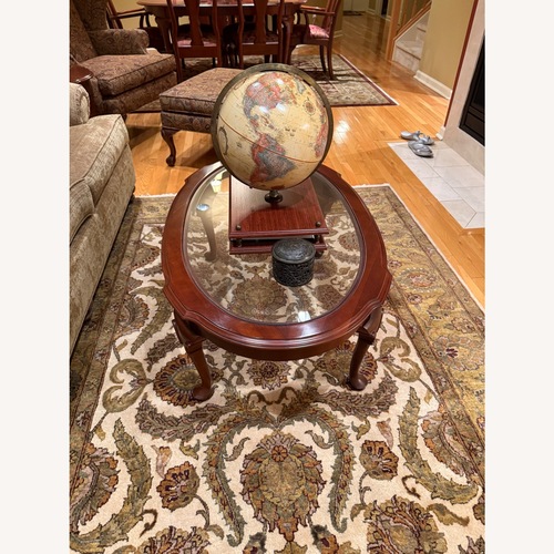 Used Ethan Allen Georgian Court Oval Coffee Table for sale on AptDeco