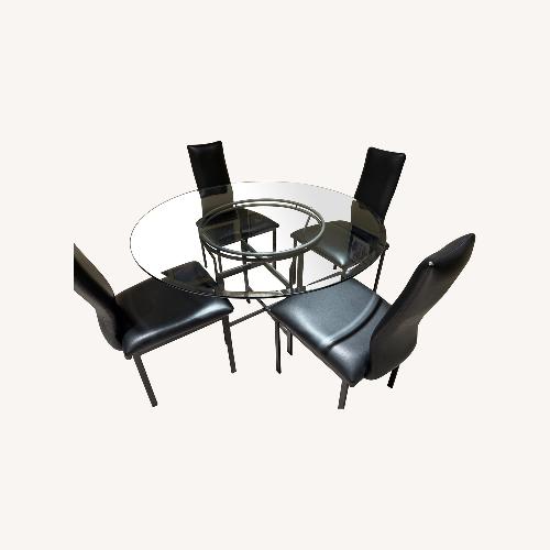 Used Glass Dining Table with 4 Black Chairs for sale on AptDeco
