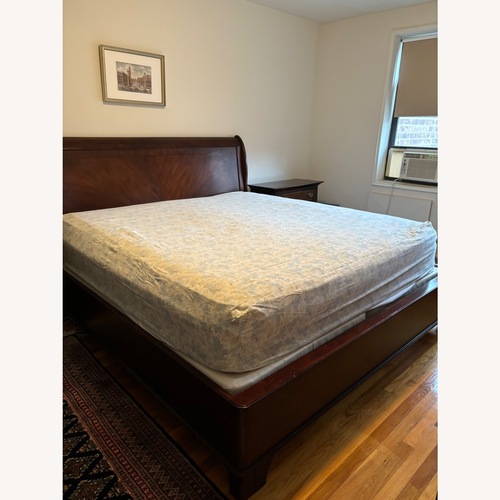 Used Raymour & Flanigan King Sleigh Bed for sale on AptDeco