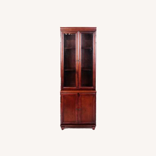 Used Bombay & Co. Cherry Bookcases w Interior Lights for sale on AptDeco