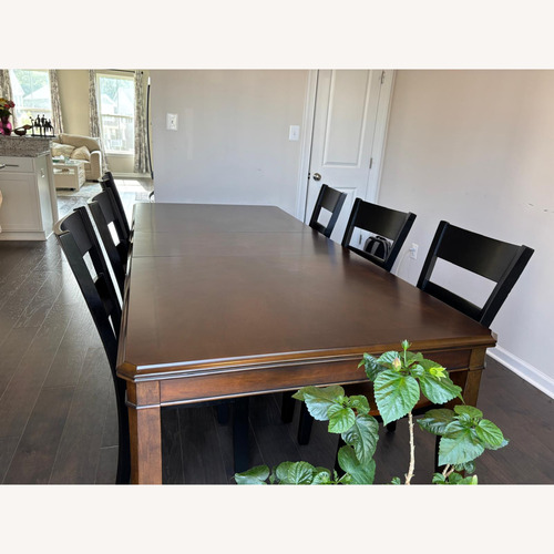 Used Hardwood 8 Seater Dining Table for sale on AptDeco