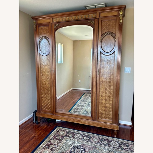 Used  Antique French Armoire With Inlay for sale on AptDeco
