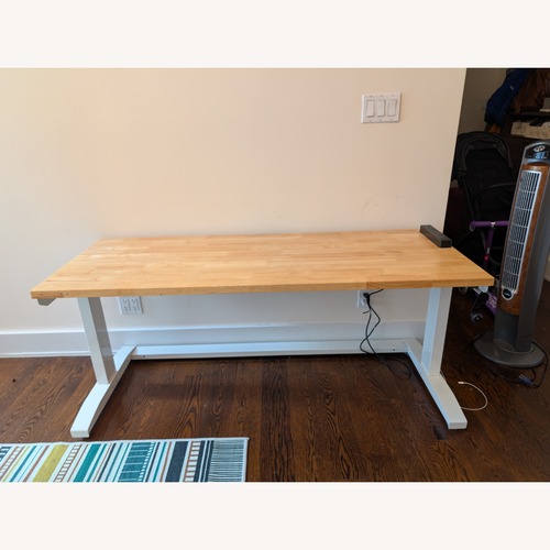 Used Husky Solid Wood Sit/Stand Desk With Wheels for sale on AptDeco