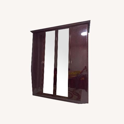 Used Four Door with Mirror Armoire Wardrobe for sale on AptDeco