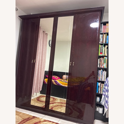 Used Four Door with Mirror Armoire Wardrobe for sale on AptDeco
