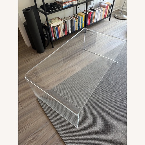 Used CB2 Peekaboo 44" Acrylic Tall Coffee Table for sale on AptDeco