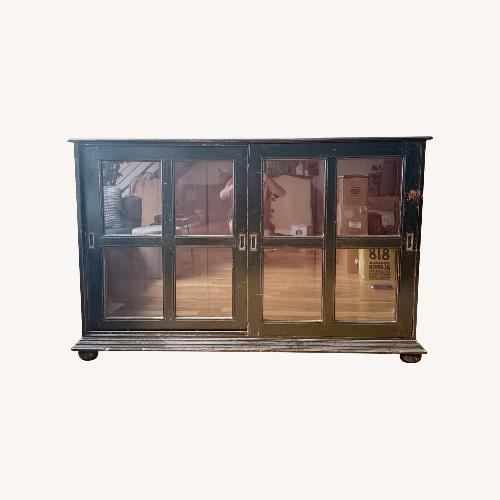 Used Black Wood Bookcase with Glass Sliding Doors for sale on AptDeco