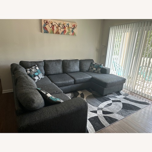 Used Dark Grey Sectional Sofa for sale on AptDeco