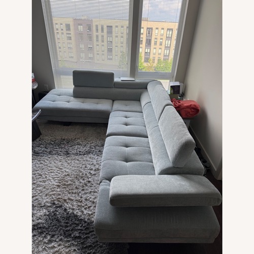 Used Avalon Light Blue 123'' 2 Piece Sectional with Ottoman for sale on AptDeco