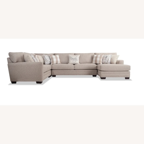 Used Cottage Chic Beige Sectional Sofa with Chaise for sale on AptDeco