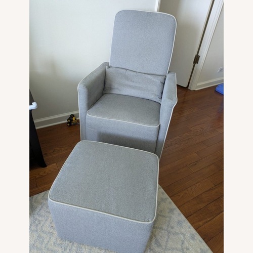 Used DaVinci Swivel Nursery Rocking Chair with Ottoman for sale on AptDeco