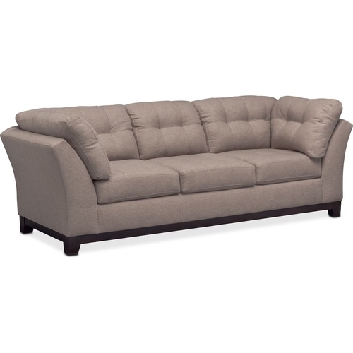 Used Medium grey two piece sectional with ottoman.   for sale on AptDeco