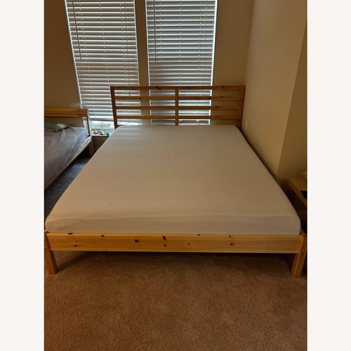 Used IKEA TARVA Pine Wood Queen Bed Frame for sale on AptDeco