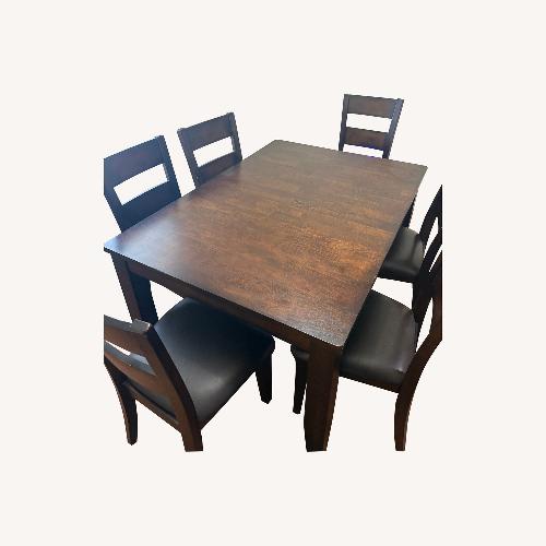Used Solid Dining Table and Chairs Set for sale on AptDeco