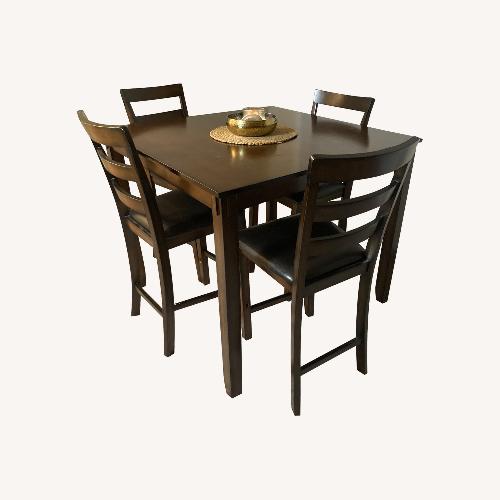 Used  Counter Height Dining Table and 4 Bar Stools Set for sale on AptDeco