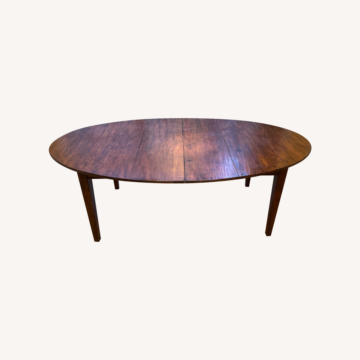 ABC Carpet and Home Extendable Oval Wood Dining Table - image-0