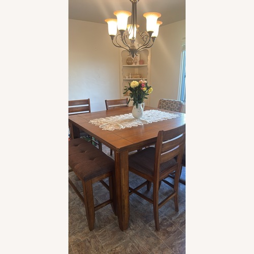 Used Dark Brown Dining Room Set for sale on AptDeco