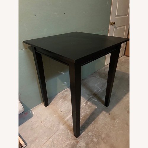 Used Black Wood Square Dining Table for sale on AptDeco