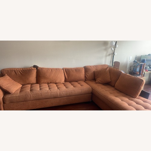 Used Rooms To Go Large Orange L-Shape Couch for sale on AptDeco
