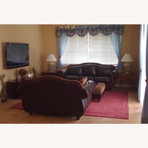 Used Chocolate Color Leather Camel Back Style Sofa for sale on AptDeco
