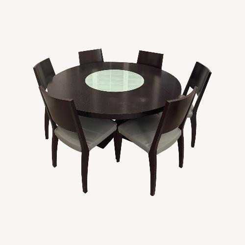 Used Dark Brown Wood Round Dining Table with 6 Chairs for sale on AptDeco