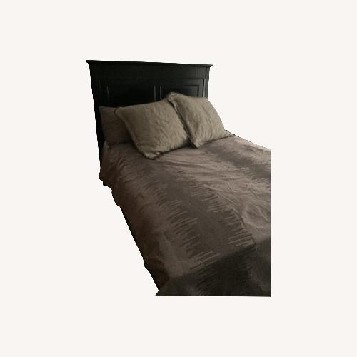 Used Raymour and Flanigan Queen Bed Frame Black for sale on AptDeco