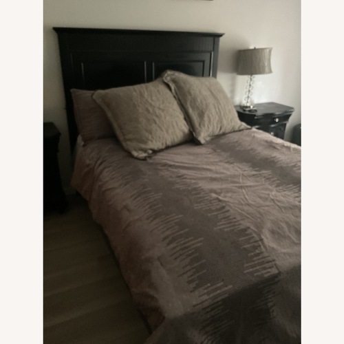 Used Raymour and Flanigan Queen Bed Frame Black for sale on AptDeco