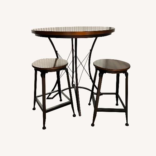 Used Steve Silver Co. Wooden Kitchen Table and Two Stools for sale on AptDeco