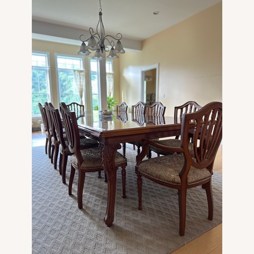 Used Artisan Teakwood 10-Seater Dining Table and Chairs for sale on AptDeco