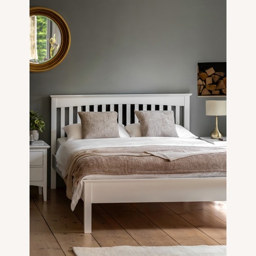 Used Queen Painted Light Gray Pine Wood Bed Frame for sale on AptDeco