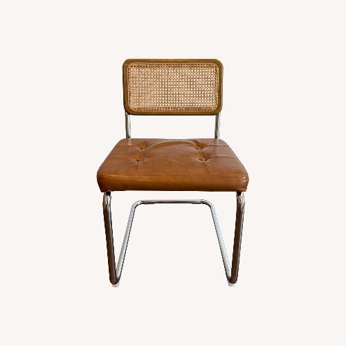 Used Rattan Dining Chairs with Metal Accents for sale on AptDeco