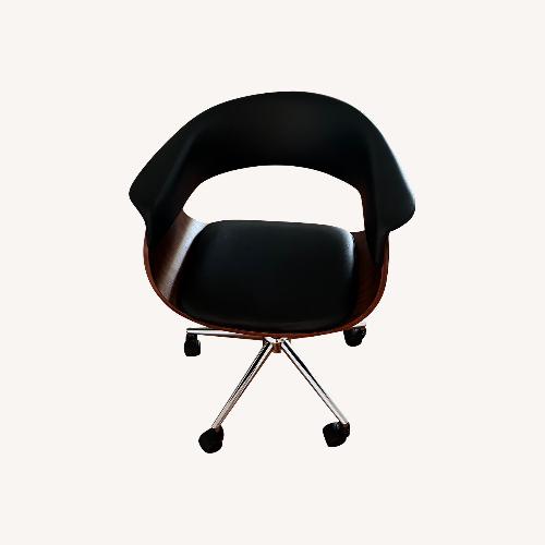 Used Black Leather and Wood Armchair for sale on AptDeco